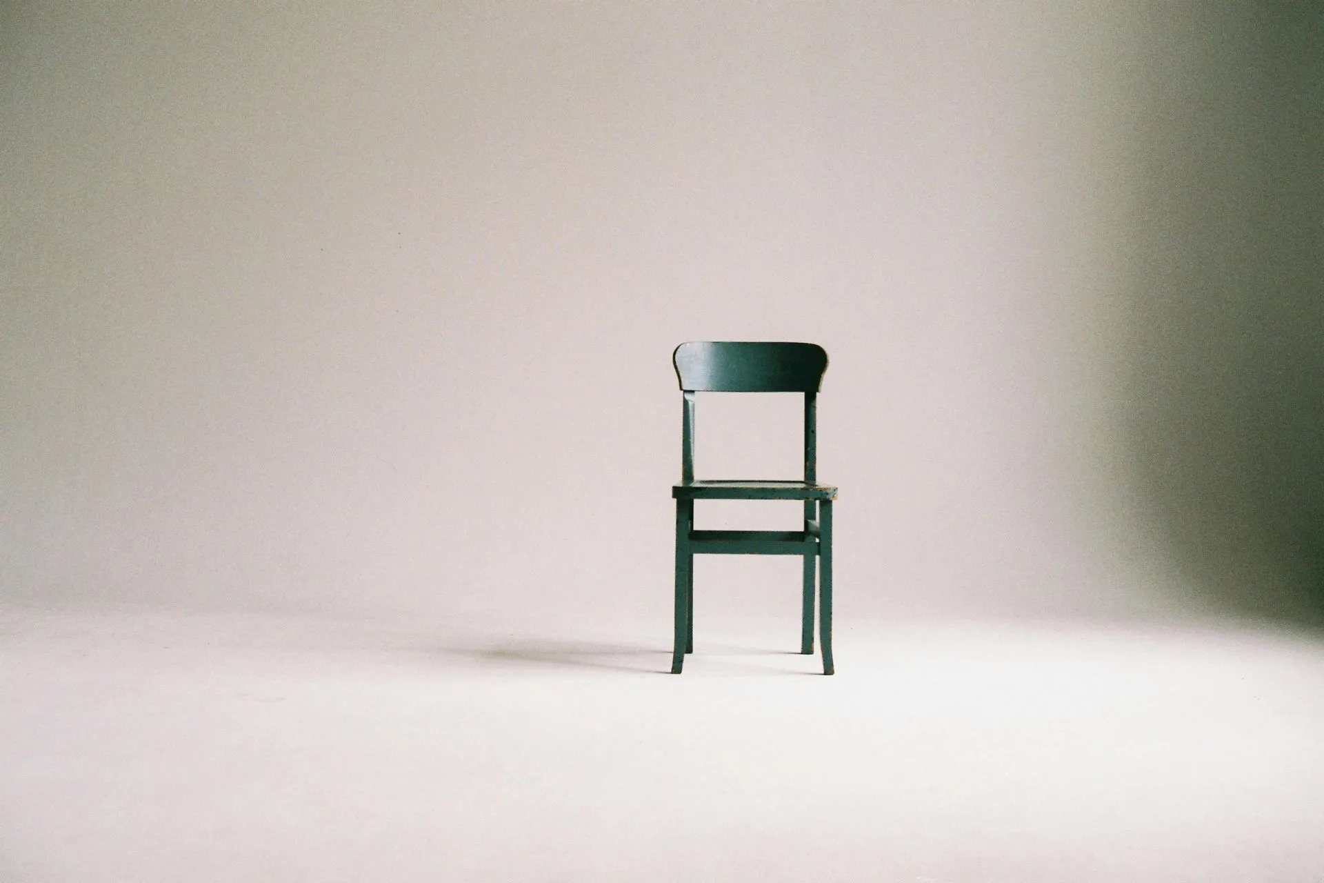 Modern chair in an empty room representing AI project management